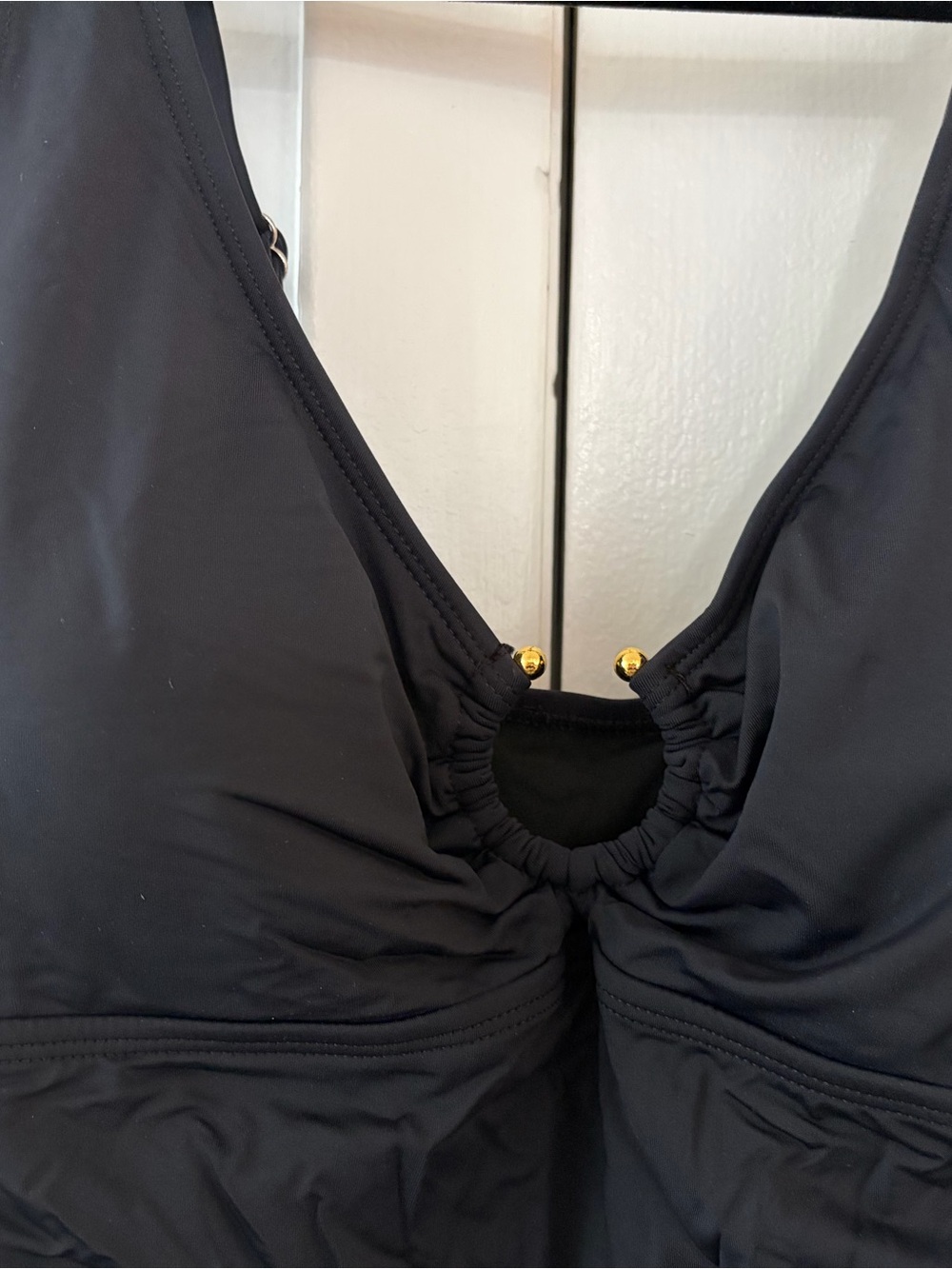 Sleek Black Women's One-Piece Swimsuit with Gold Accent